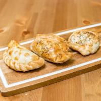 Argentinian Empanada · Baked. Tradicional Argentinean baked (beef, chicken, ham and cheese, spinach, capresa).