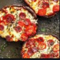 Portobello Pizza · Portobello mushrooms, caramelized onions, roasted garlic and mozzarella cheese with garlic s...