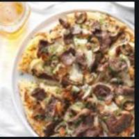 Steak Pizza · Steak, onions, green peppers, mushrooms, tomatoes, mozzarella cheese and tomato sauce.