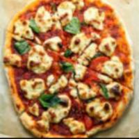 Margherita Pizza · Fresh mozzarella cheese, basil, tomatoes with tomato sauce.