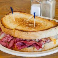 3. Grilled Reuben · Corned beef with sauerkraut, Swiss cheese and Russian dressing.