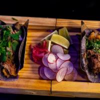 Quinoa Shrimp Tacos · 2 quinoa crusted marinated shrimp tacos with, napa cabbage slaw, mango salsa, roasted garlic...