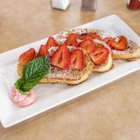 Cinnamon Vanilla French toast · topped with fresh strawberries, powder sugar and sweet marscapone cheese. butter & syrup on ...
