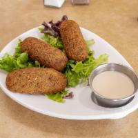 Falafel 3 pieces. · Ground chickpeas, onion, parsley and spices, deep fried to crispness, served with side tahin...