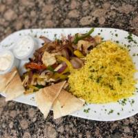 Fajita Pita Plate · Choice of beef or chicken shawarma, Gyro meat or Jumbo shrimp, grilled with tri-color bell p...