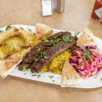 Quad kabob plate  · One skewer of each lamb, beef, chicken, and shrimp, served with rice, house salad, humus and...