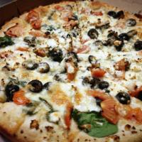 Greek Pizza · Spinach, tomatoes, garlic, olives, and topped with feta cheese.