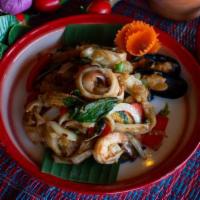 #T12 Pad Kee-Mao · Stir-fried fresh flat noodles with your choice of meat in spicy basil sauce