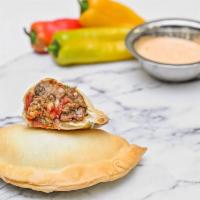 Impossible Chicken Empanada · Marinated jack fruit, onion, red pepper, diced tomato, zucchini, Italian seasoning.
