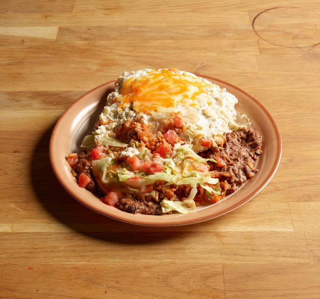 Burrito Dinner · Beef burrito, cheese tostada, chile Relleno and Spanish rice.