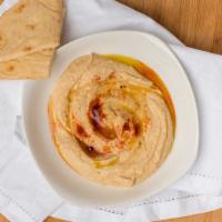 Classic Hummus · Lebanese specialty dip from garbanzo beans, garlic, lemon, olive oil and tahini. Served with...