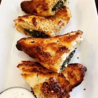 Grandmas Spanakopita · Spinach, feta cheese, Greek olive oil and onions, baked in puff pastry. Served with tzatziki...