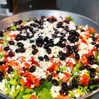 Greek Salad · Tomato, cucumber, Kalamata olives, romaine lettuce and feta cheese. Tossed in our homemade G...