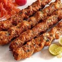 Veggie Shish Kebab · Two grilled seasonal vegetable skewers. Served over rice pilaf and Greek salad. Vegetarian.