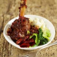 Lamb Shank · Very tender lamb served with sautéed vegetables and your choice of mashed potato or rice pil...