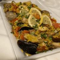 Mozaic Paella · House specialty made with mussels, clams, salmon, shrimp, snapper, chicken and linguica saus...