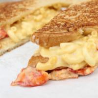 The Lobster Mac Sandwich · Our homemade mac with chunks of real fresh lobster drizzled with white truffle oil grilled o...