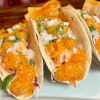 Bang Bang Shrimp Tacos · Crispy shrimps, bang bang sauce, crunchy slaw, cilantro. Served 3 per order. With a side of ...