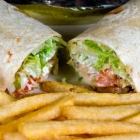 Chicken Wrap · Roasted garlic chicken, lettuce, tomato and your choice of sauce wrapped in a tortilla.