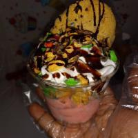 Kids Cookie Sundae · (SC). Pick a ice cream flavor, M&M's, chocolate drizzle , Whipped cream topped with a Random...