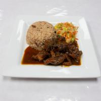 Brown stew chicken · Smaller  portion of rice and peas and cabbage
