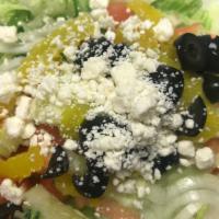 Greek Salad · Served with lettuce, tomato, bell , onion , feta, cucumber, and olive.