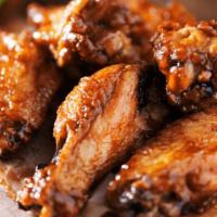 25 Traditional Wings · Tossed in sauce of your choice. Comes with carrots, celery, and Ranch.