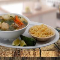 Chicken Soup  · Caldo de pollo. Served with rice, jalapeno and tortillas. Servido con arroz, jalapeno y tort...