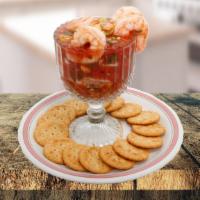 Shrimp Cocktail  · Octel de camarones. Served with crackers. Servido con galletas.