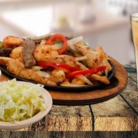 Mixed Fajita Dinner · Steak, chicken, and shrimp, with onions and peppers. Served with lettuce. cheese and sour cr...
