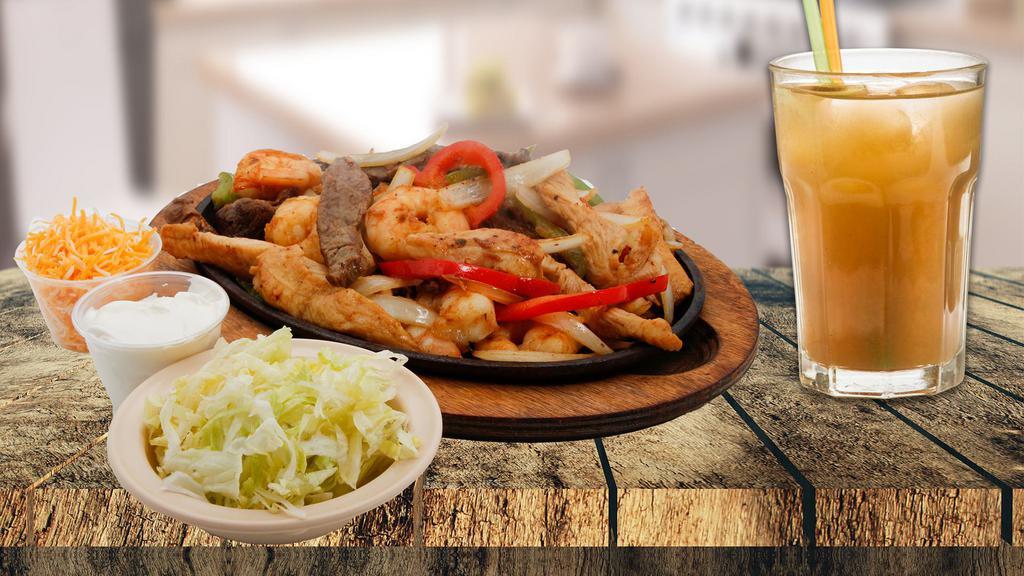 Mixed Fajita Dinner · Steak, chicken, and shrimp, with onions and peppers. Served with lettuce. cheese and sour cream. 