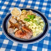 Gemischte Wurstplatte · Mixed German sausage platter, featuring bratwurst, smoked sausage and knackwurst served with...