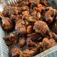 Brown Stew Chicken · Served with rice or rice and peas and vegetables.