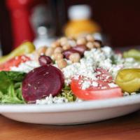 Greek Salad · Blend of spring mix, romaine and iceberg, topped with fresh roasted beets, feta, cucumber, t...