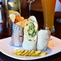 Chicken Caesar Wrap · Grilled chicken, romaine lettuce, croutons, Caesar dressing wrapped in an Italian piadina.