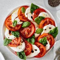 Caprese Salad · Roma tomatoes, fresh mozzarella, basil, extra virgin olive oil and balsamic reduction. Extra...
