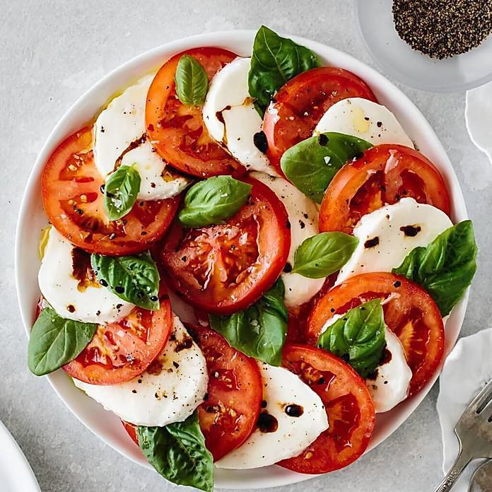 Caprese Salad · Roma tomatoes, fresh mozzarella, basil, extra virgin olive oil and balsamic reduction. Extras for an additional charge.