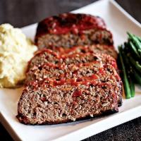Not your Mommas Meatloaf · Thick sliced flame grilled meatloaf with a brown sugar tomato glaze served with mashed potat...