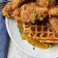 Chicken & Waffles · Belgium waffles & fried chicken tenders served with an orange bourbon maple syrup and drizzl...