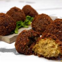 6 Pieces Falafel · Ground chickpeas mixed with vegetables, prepared with own spices and deep fried. Vegetarian.