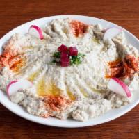 Baba Ghanouge · Smoked eggplant, pureed and mixed with olive oil, lemon juice and garlic. Vegetarian and glu...