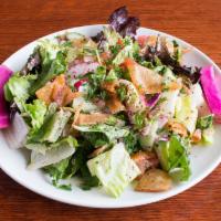 Fattoush Salad · A fresh mix of cucumbers, tomatoes, radish, cabbage, pita chips and Romaine lettuce tossed i...