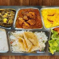 The Classic Thali · Chicken Tikka Masala	
Chole/Chana Masala
Saag Paneer
Raita
Rice
2 Chapati or 1 Naan
