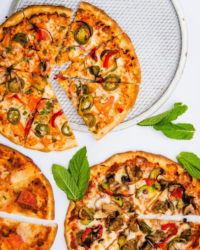 Tandoori Pizza: The New Delhi · Chutney marinara, red onion, bell pepper, jalapeno, and mushroom.