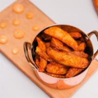 Masala Fries · House made potato wedges with fresh ground spices and herbs. Served with your choice of dipp...