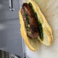 Choripan  · Argentinian’s favorite sandwich. Served with chimichurri & caramelized onions on French bagu...
