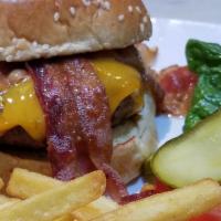 Bacon Cheeseburger · Half a pound of ground chuck char-grilled and topped with bacon and American cheese served o...