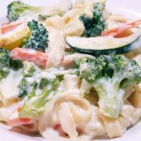 Veggie Alfredo Pasta · Broccoli, carrots, and zucchini squash tossed in a creamy Alfredo sauce served over fettucci...
