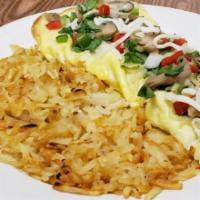 Vegetable Omelet · Diced peppers, onions, mushrooms, spinach, tomatoes, and mozzarella. Served with hashbrowns.
