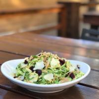 Brussels Sprout Salad · Shredded brussels sprouts, bacon, roasted corn, feta, with our mustard vinaigrette